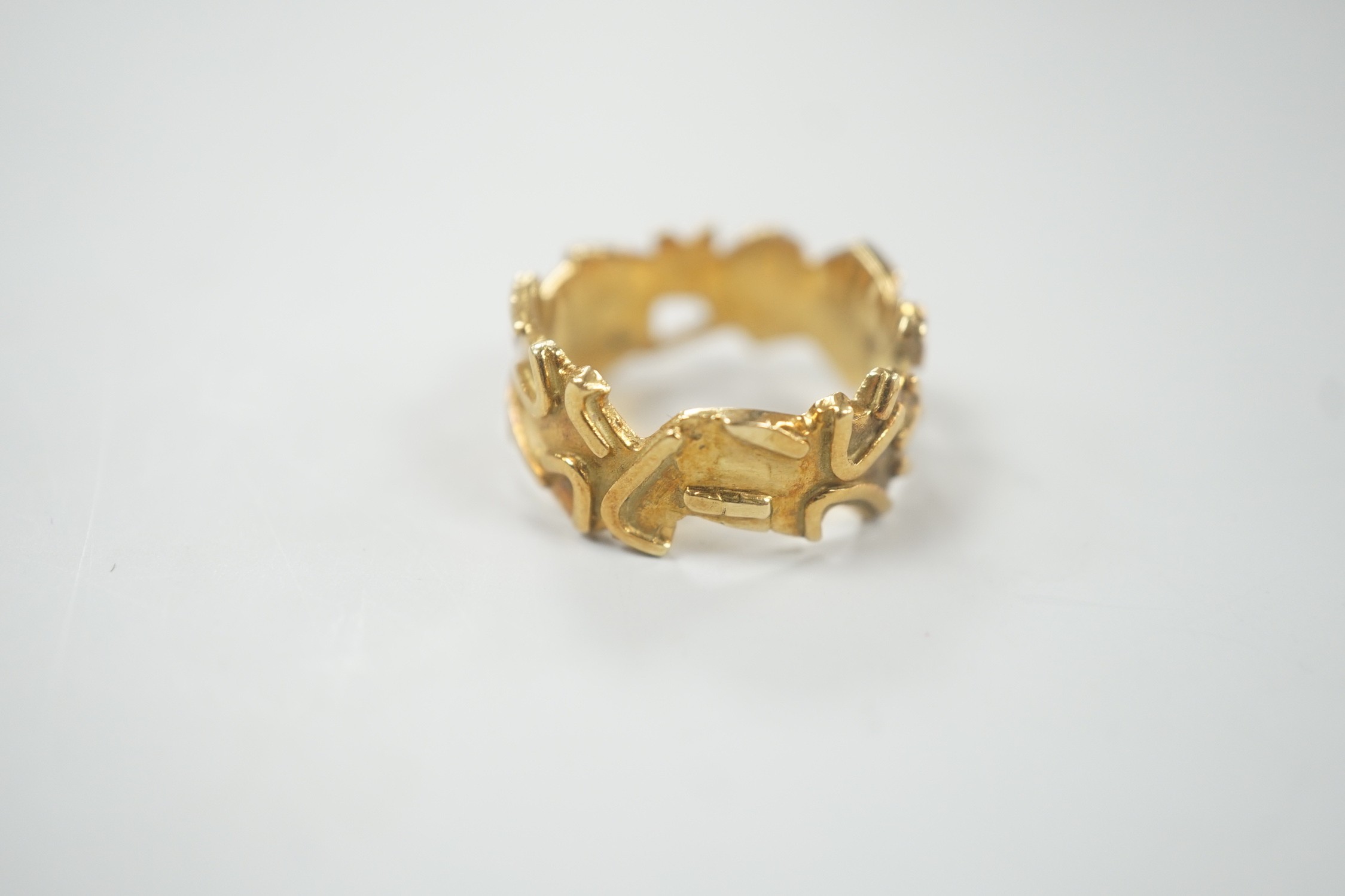 A modern stylish 18ct gold band, size N/O, 7.8 grams.